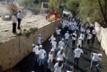 رياضيون سوريون ينظفون نهر بردى